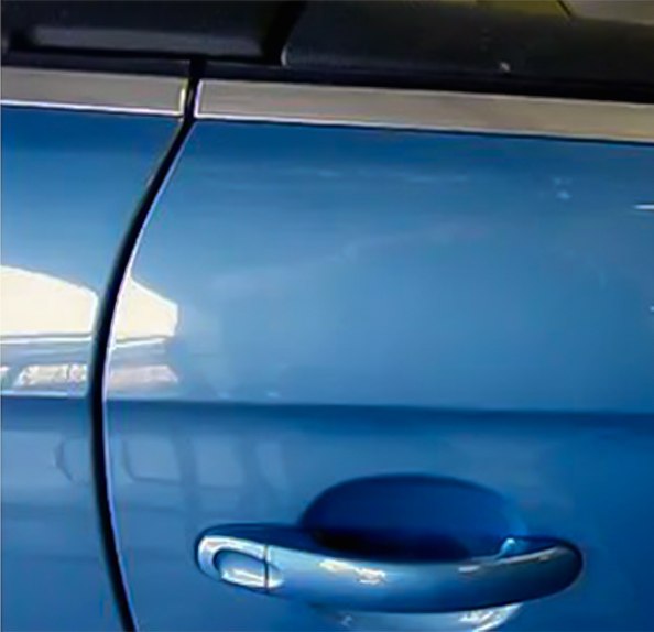 Blue door after paintless dent repair